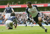 Aaron Lennon wheels away after scoring the deciding goal of our last game against Bolton