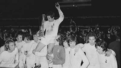 Skipper Alan Mullery is hoisted high with the 1972 UEFA Cup