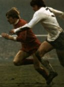 Cyril Knowles seen in action in 1971 at Anfield chasing Steve Heighway
