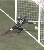 What the officials did not see. Roy Carroll reaches a yard into the goal to paw the ball back into play
