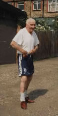 Bill strikes a jovial pose, at home, near White Hart Lane