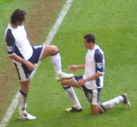 Goal-scorer Mido and ex-Newcastle player Jenas contrive a special celebration in this season's New Year's Eve game! My thanks to Gerry Taylor for this excellent shot