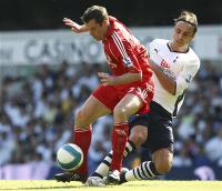 Dimitar Berbatov in action with Liverpool's Jamie Carragher