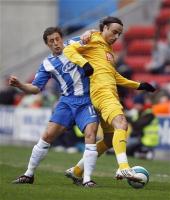 Spurs scorer Dimitar Berbatov is seen here being challenged by former Spur, Michael Brown