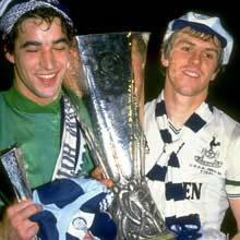 Spurs heroes Roberts and Parks hold aloft the UEFA Cup in 1984