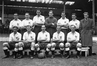 Eddie Baily is pictured here amongst the 1950-51 League Champions. Left to right (back) - Ramsey, Nicholson, Clarke, Ditchburn, Duquemin, Willis, Walters - (front) - Castle, Bennett, Burgess (Capt.), Baily, Medley.
